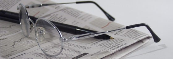 glasses on newspaper glasses on newspaper