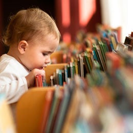 Dad reaching for books
