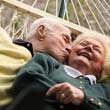 elderly couple embracing