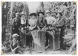 Hops farmers with bushels of crops
