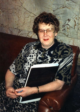 Adele Ferguson, capitol correspondent
                              for the Bremerton Sun, takes a break outside the legislative chambers in the 1960s.
                              Adele Ferguson’s scrapbook.