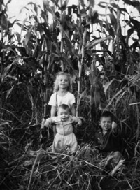 With brothers Gary and Bobby in the cornfields.  Dunbar personal collection.