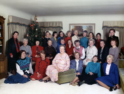 Judge Betty Howard, seated center on ottoman, at a Christmas
party at the Dimmick home in the 1980s with some of the
female lawyers she had befriended and mentored over the
years. Carolyn Dimmick is in the back row, fourth from left.