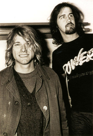 Kurt Cobain, left, and Krist Novoselic
                    pose in their dressing room backstage at the Paramount Theater in Seattle after
                    Nirvana	’s performance on October 25, 1991. Their landmark album, "Nevermind," made
                    its debut that week. By January it was number one on the Billboard Top 200 Album
                    Chart. Photo courtesy Darrell Westmoreland