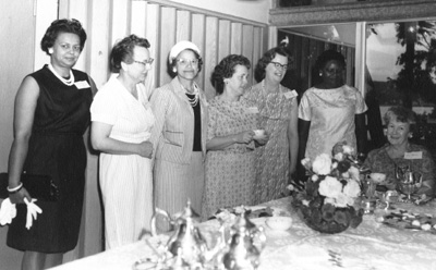 The annual tea of the Carver Civic Club in 1966. Hazel Colvin is at left, Mrs. Walker third from left, and Gert Joseph fifth from left.