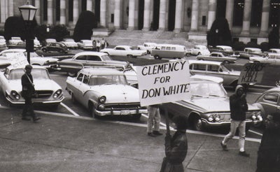 Death penalty opponents picket at the steps of the Capitol, urging  Governor Al Rosellini to grant Don Anthony White clemency.