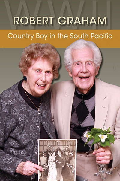 Bob and Lloydine Graham pose for a portrait with their 1945 wedding photo. Laura Mott Photo