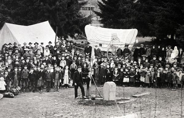 Ezra Meeker setting historical marker 1906 Feb. 19. Setting historical marker in Tenino, WA w/ pioneers.