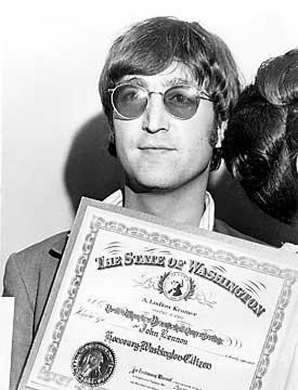 John Lennon with OSOS certificate John Lennon with OSOS certificate