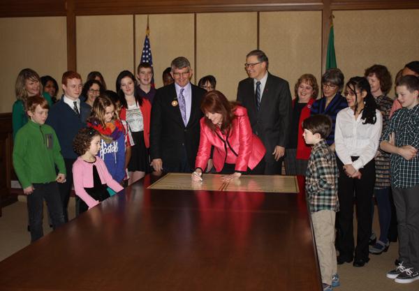 Kim signs library declaration
