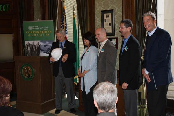 Sam trying on Korsmo hardhat at CFC ceremony 002