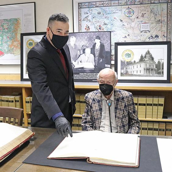 StateConstitution_030222_2251_564x564 Washington Secretary of State Steve Hobbs (left) pointing to a page of the original Washington State Constitution with Frank Porter Hungate.