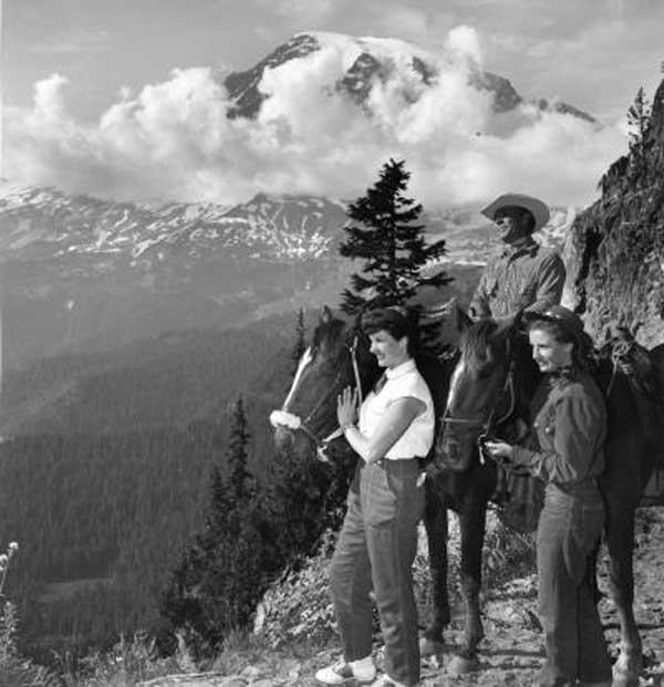 Trail near Mt. Rainier with horse riders Trail near Mt. Rainier with horse riders