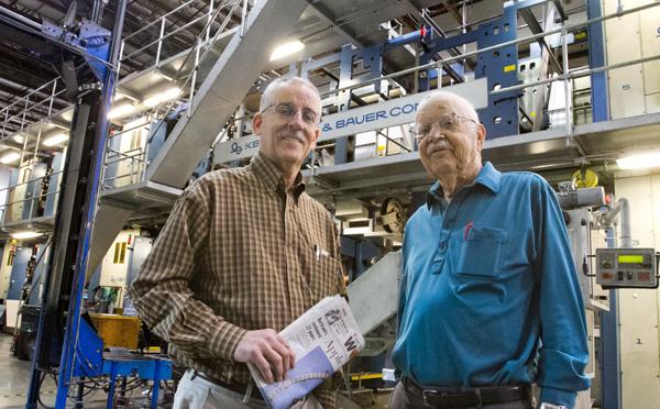 043013 World photo/Mike Bonnicksen Rufus Woods, at left, and his father Wilfred Woods in front of the Wenatchee World press.