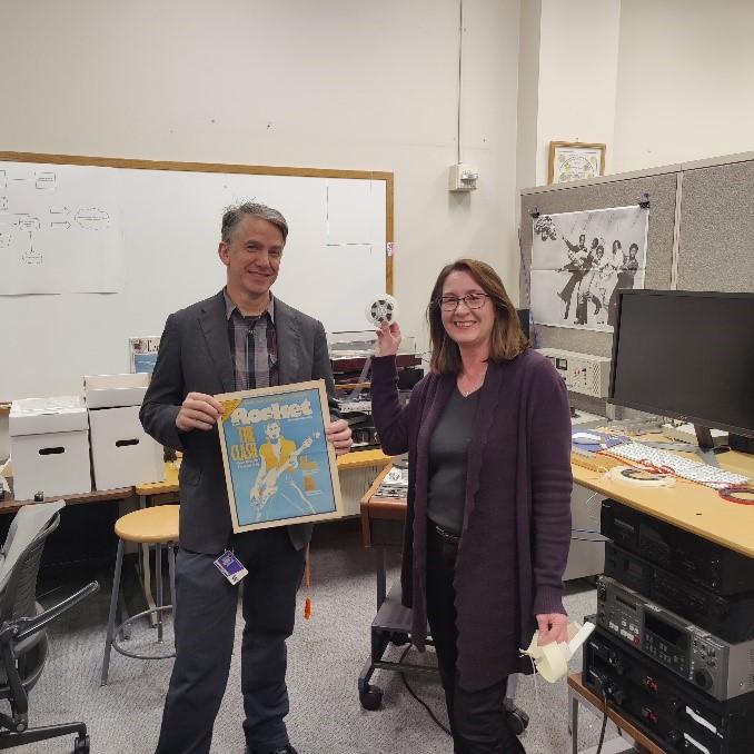 John Valler from the University of Washington Libraries stands next to Shawn Schollmeyer, Washington Digital Newspapers coordinator.