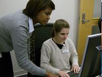 Two women working at a computer