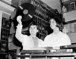 Two women looking at a record