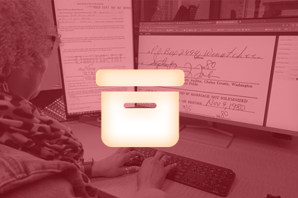 A volunteer uses a computer to transcribe documents. An icon of a file box is overlaid.